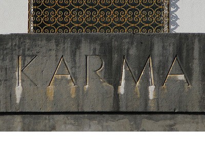 The word 'Karma' carved in stone.