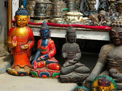 Four small Buddha statues.