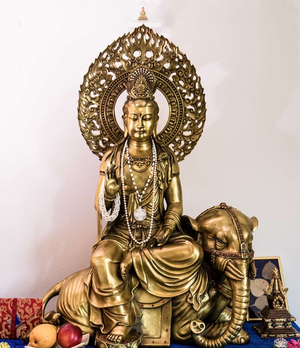 Bronze statue of Kuan Yin appearing as Samantabhadra on an elephant.