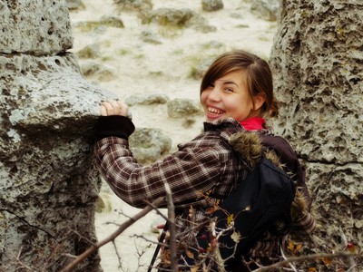 Tenenaged girl, smiling.