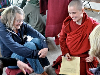 Venerable Jampa smiling during a discussion with an Abbey retreatant.