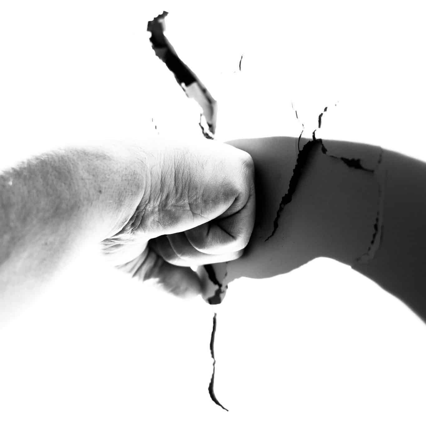 A man fist on the wall and the wall cracked.