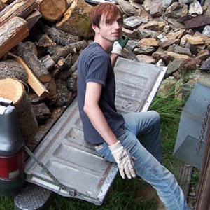 Karma unloading next winter's firewood from the Abbey truck.