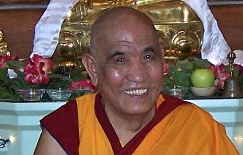 Ganden Tripa Lobsang Tenzin Rinpoche smiles at the camera.