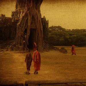 Monks with different colored robes, walking together.