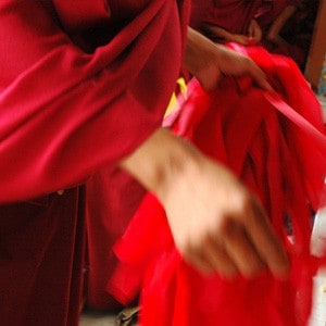 Maroon robes.