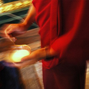 Tibetan monk performing tantric ritual.