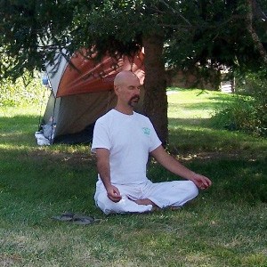 Tom meditating outside at the Abbey.