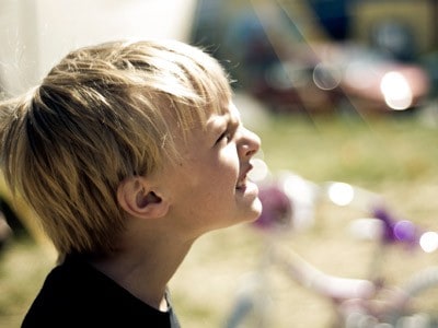 A young boy showing his angry face.