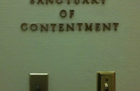 A wall with the words: Sanctuary of Contentment