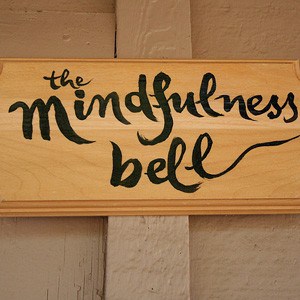 A sign with the word : the mindfulness bell written.