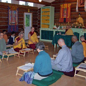 EML group in sitting position and chanting.