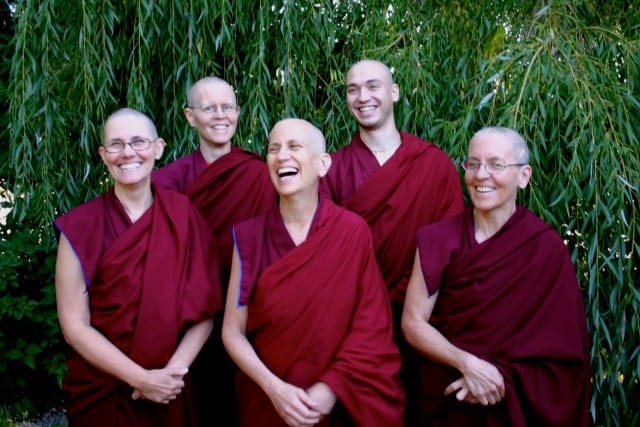 Venerable Chodron and Abbey monastics smiling happily.
