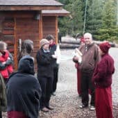 Guy Newland talking to Venerable Chodron outside the Abbey meditation hall.