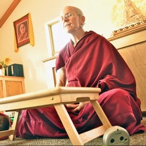 Venerable Semkye leading morning chants.