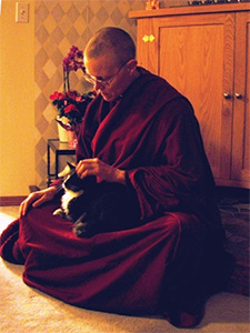 Venerable Tarpa holding the cat Achala.