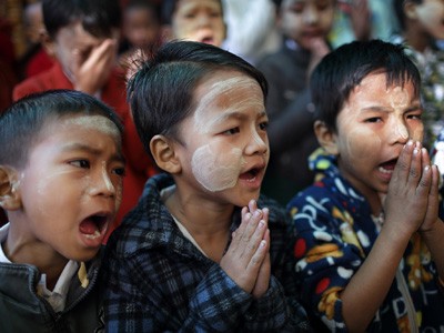 Boys at the morning prayer in a monastic school in Myanmar.