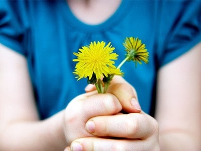 Woman holding flowers.