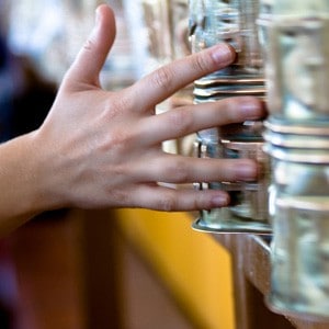 Hand turning large prayer wheels.