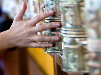 Hand turning large prayer wheels.