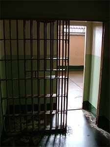 Metal bars of a solitary prison cell.