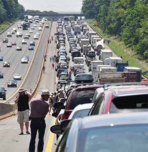 Long line of cars in a traffic jam on the highway.