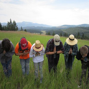 A group of teens bowing