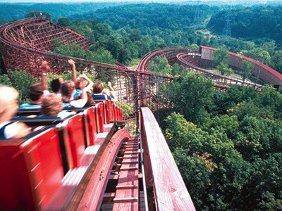 Roller coaster about to go down a big hill.