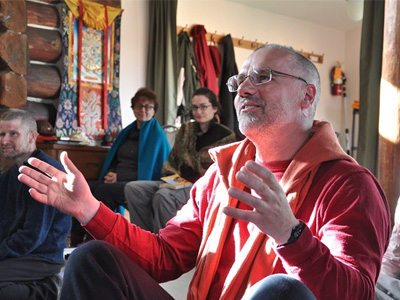 Abbey retreatant in discussion during a Dharma talk.