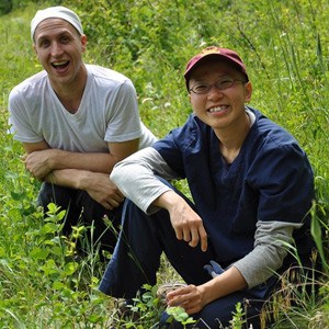 Venerable Damcho and Byoghen take a break during a knapweed pulling adventure to Sukhavati.