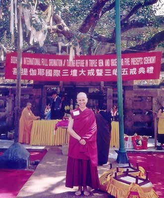 Venerable Chodron standing in front of "the temple".