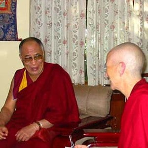 Venerable sitting with His Holiness the Dalai Lama.