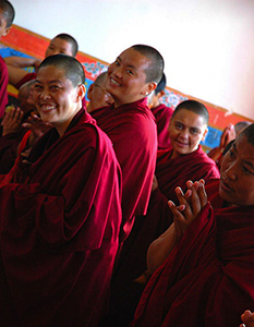 Tibetan nuns, smiling.