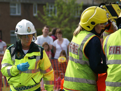 Firefighters helping someone.