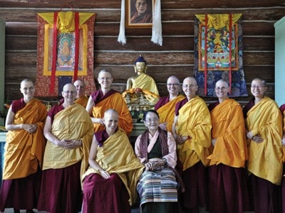 Abbey monastics with H.E. Dagmo-la in the meditaiton hall.