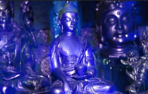 Blue statue of Medicine Buddha.