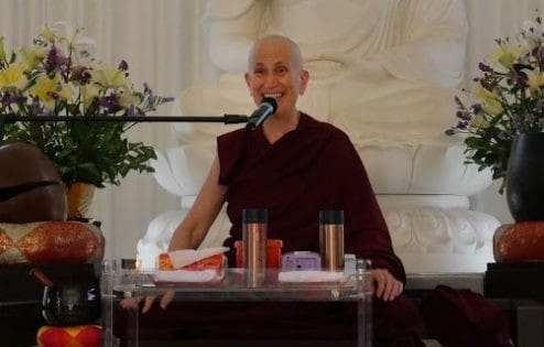 Venerable teaching and smiling.