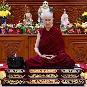 Venerable sitting in meditation posture before teaching.