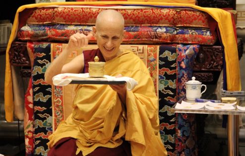 Venerable Chodron spins a mani wheel.