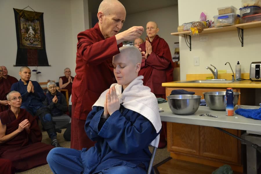 Venerable Thubten Chodron shaves the head of Rebecca Bradley at her novice ordination.