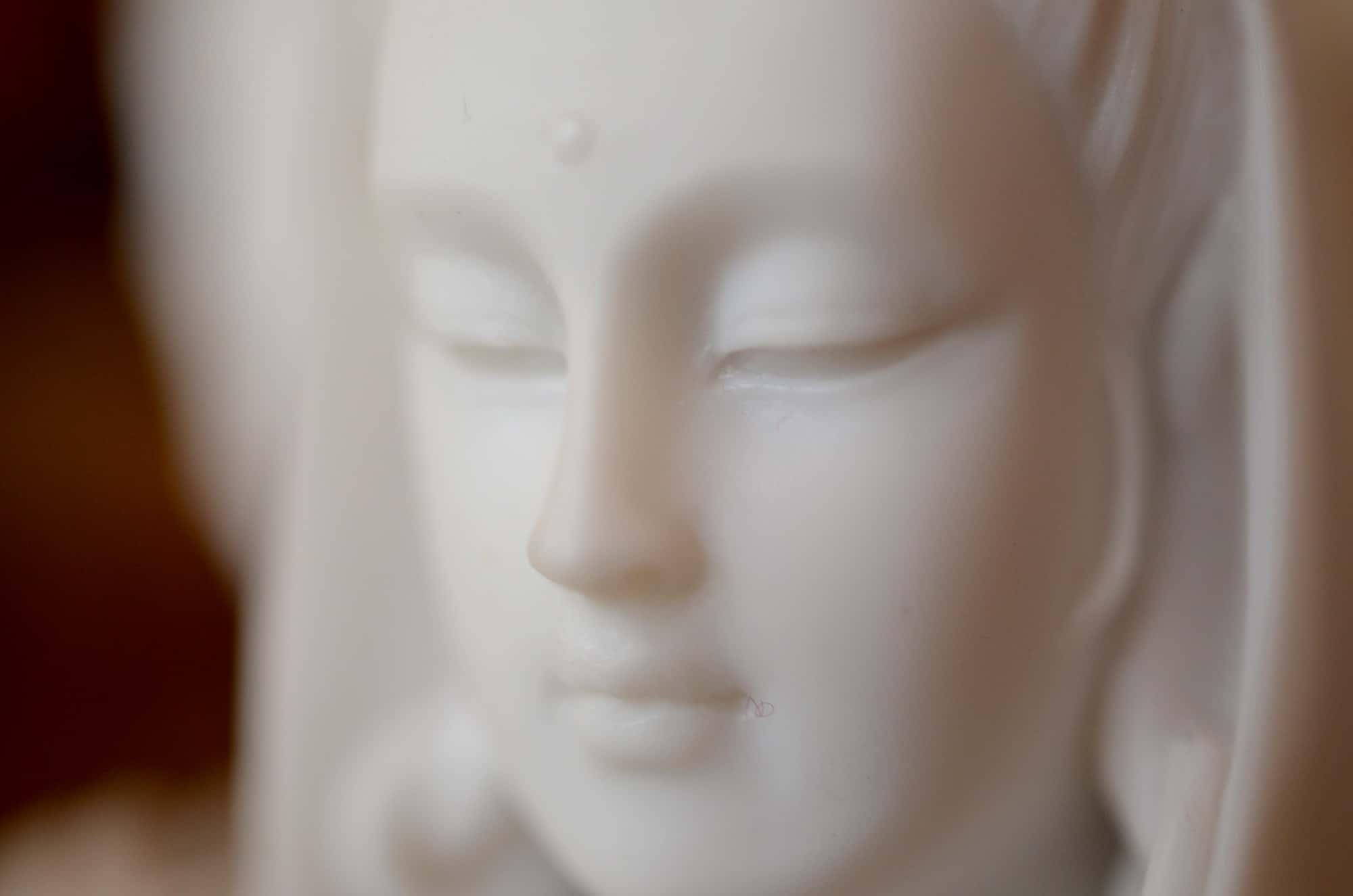 Closeup of the face of Kwan Yin.