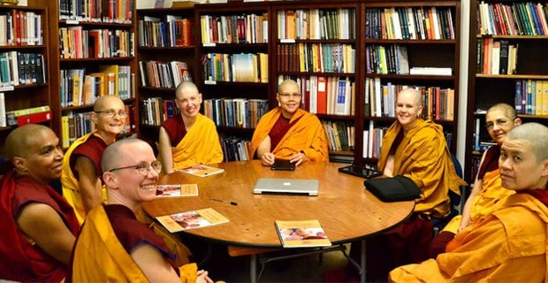 A group of shiksamanas in the Abbey library reading their precepts at the round table.