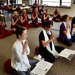 Exploring Monastic Life participants sit with khatas around their necks at the request for training ceremony.