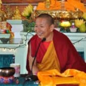 Geshe Yeshi Lhundup smiles while teaching in the Meditation Hall.