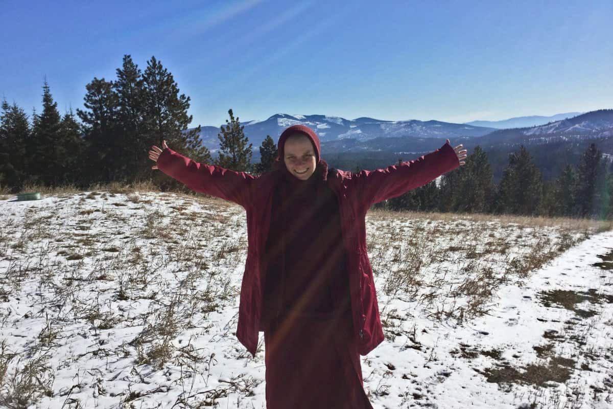 Venerable Jampa smiling with arms open.